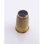 Golden thimble20th centuryRound, conical shape with final onyx plate, honeycomb wall and engraved