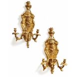 Pair of large Napoleon-III-style wall appliquesParis, around 1900On richly relieved wall plates with