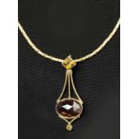 Turmaline trinket with gold necklaceLate 20th C.Gold 14k. Marked. Trinket H. 5 cm, necklace L. 39