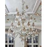 Large chandelierMurano, 20th c.On richly structured glass baluster on four levels a total of 24