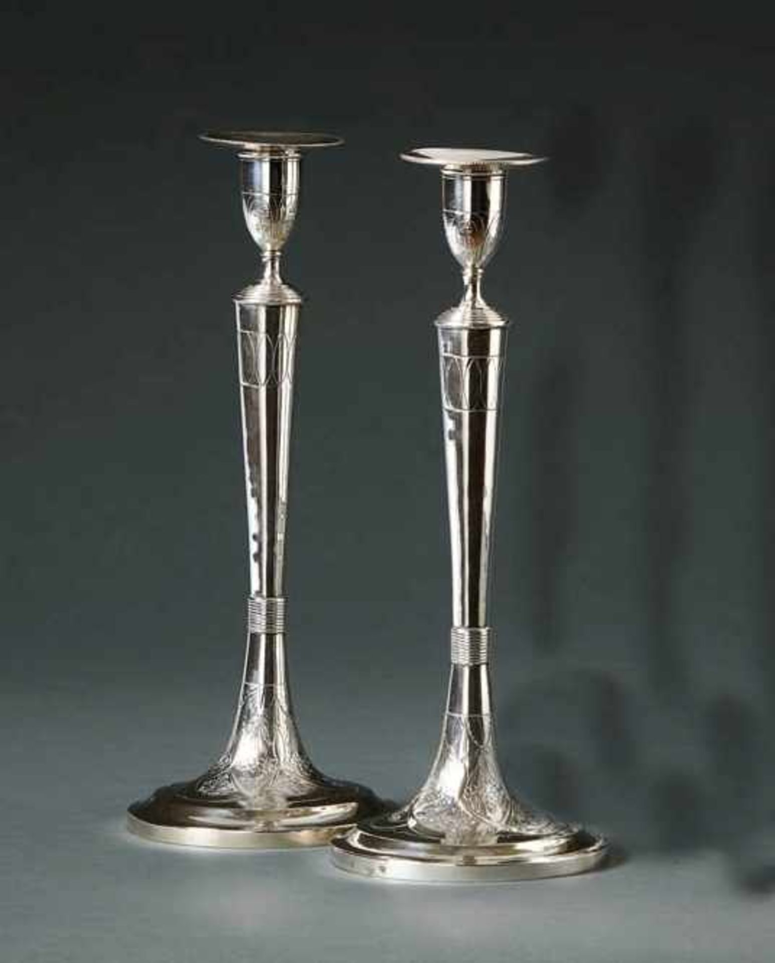 Pair of elegant candlesticksAustria-Hungary, 1821Trumpet foot with flower pendant framed by bands,