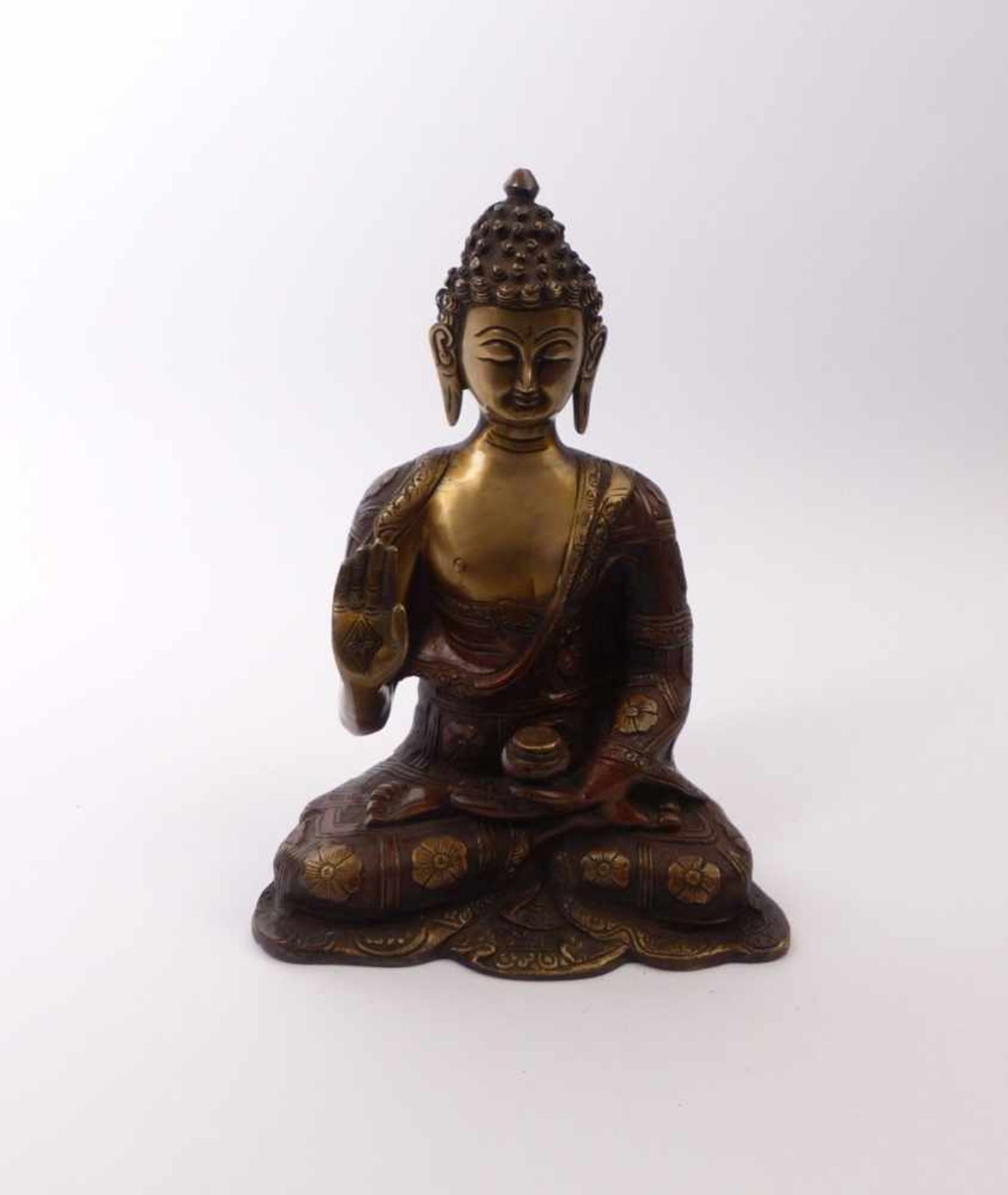 Sitting Buddha in Padmasana with alms bowlBeg. 20th C.Bronze with brown and gold patina. H. 25,5