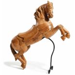 Ascending horse19th centuryFull round with decorated bridle and saddle, the forefeet raised, on