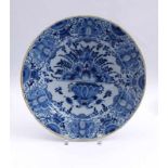 Large plate with flower vase decorationDelft, 18th century.Round, recessed shape, flower vase in