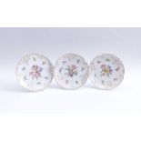 Three flower platesNymphenburg, around 1900Small, round, flat form with ornamentally openworked