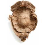 Console18th c.Convex oval with reliefed eagle head in rocaille frame, flanked by sculpturally