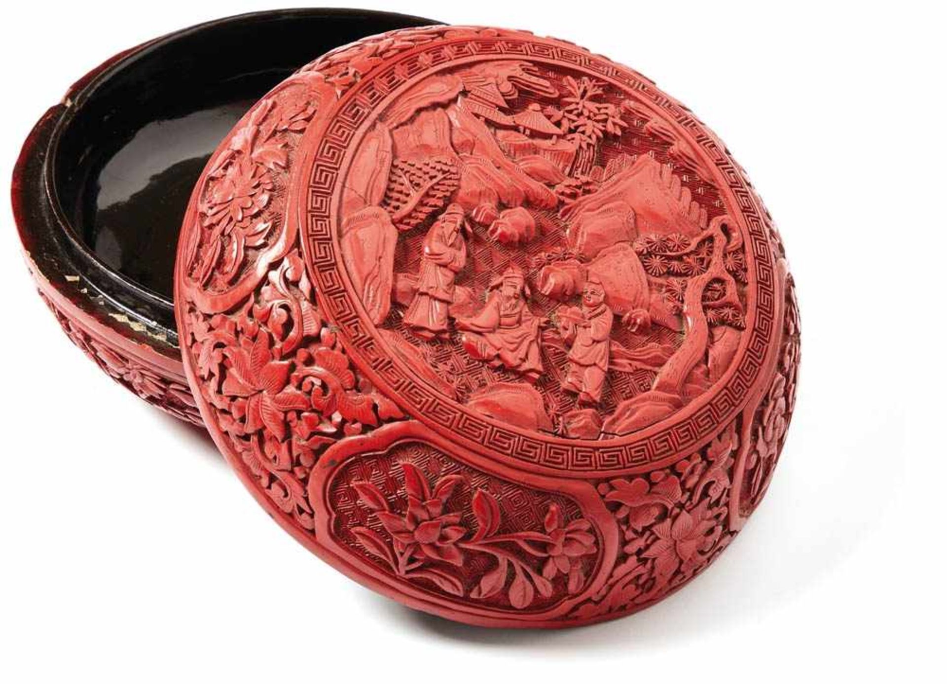 Round red lacquer box with coverChina, circa 1780Belly-shaped form with floral ornamented reserves