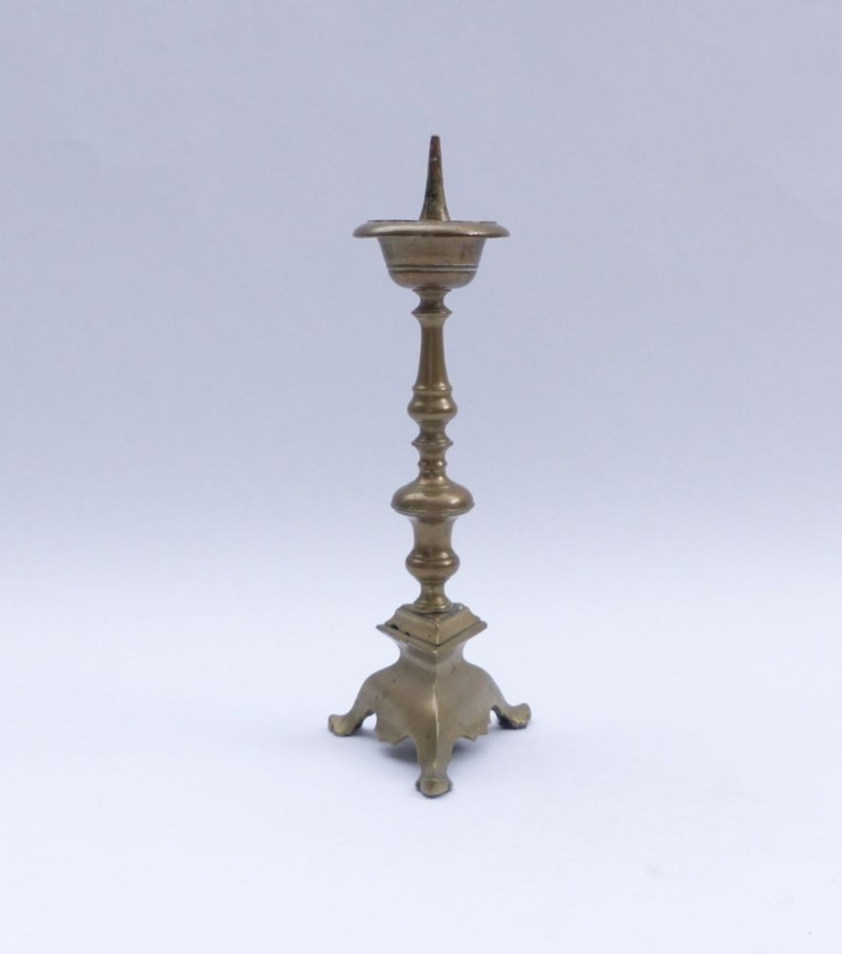 Baroque chandelierCirca 1700Three-sided stepped pedestal on three stylized paw feet, jointed