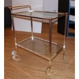 Serving trolleyItaly, 2nd half 20th c.With four fluted legs on wheels, two glass shelves, three