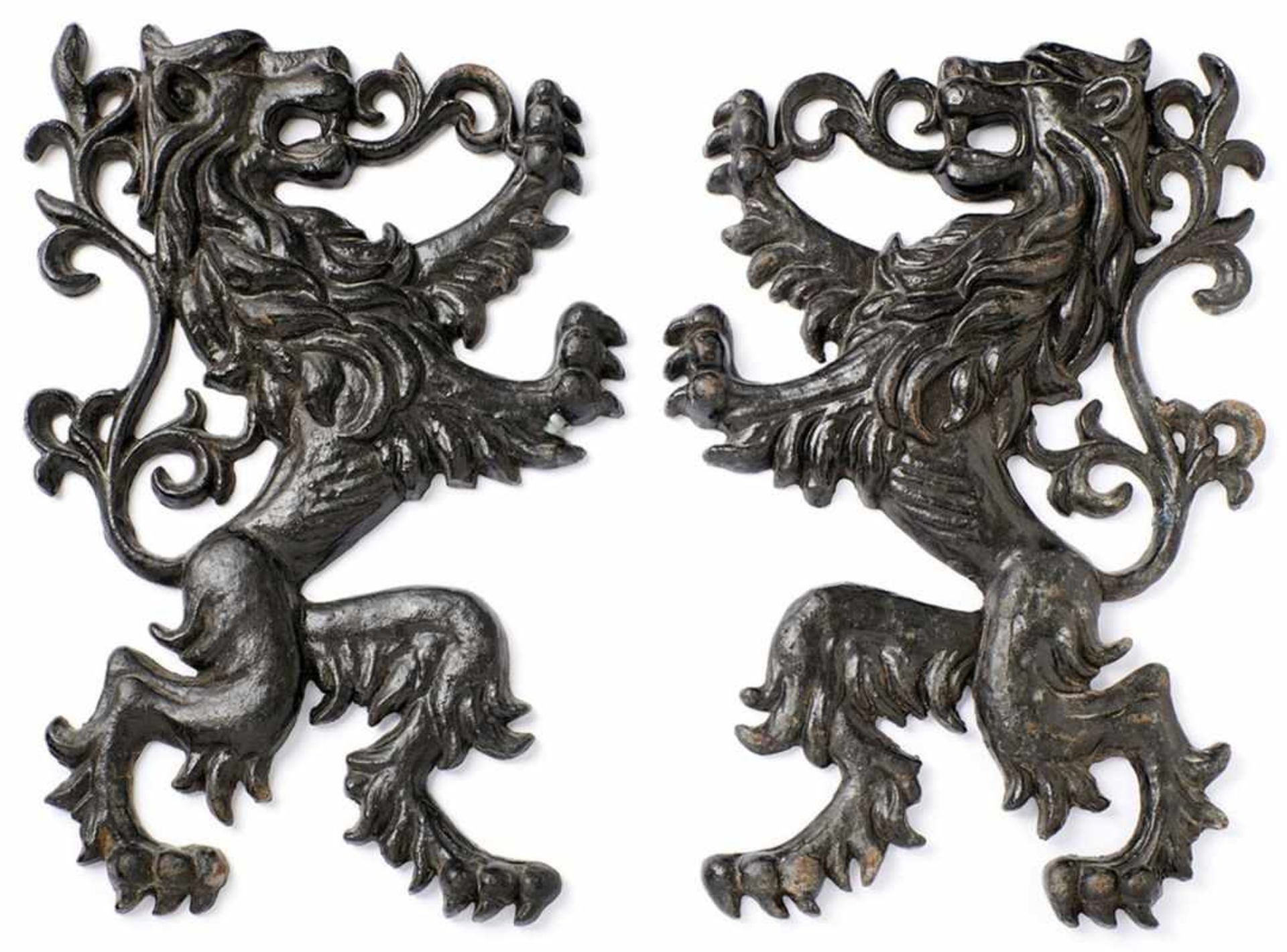 Pair of lions as wall applications19th centuryLion figures in relief standing opposite each other,