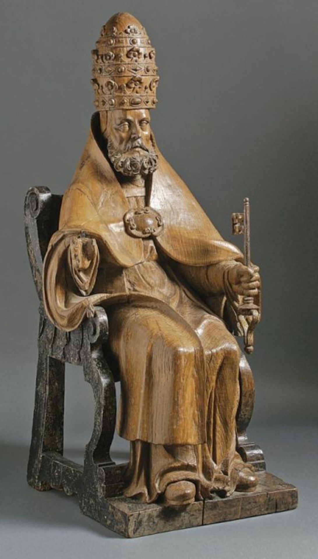Saint Peter with tiaraFlanders, late 16th centuryA saint sitting on an open carved chair in an