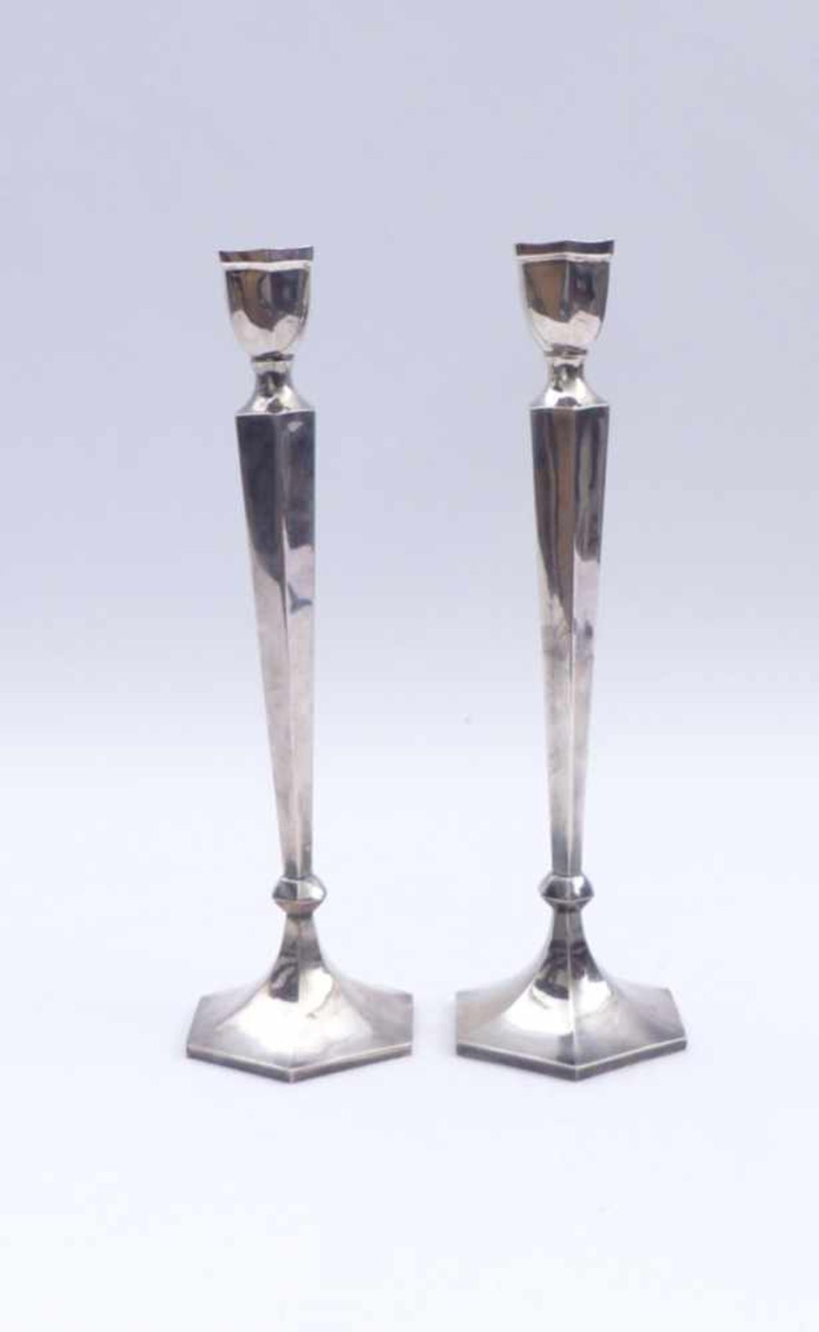 Pair of candlesticksChinaHexagonal, slim shape. Silver (?). Two marks at the bottom. H. 31 cm; 692