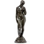 Female NudeAround 1900Nude woman standing on a profiled, round marble base in contrapost with her
