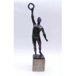 Athlete with laurel wreathFirst half of the 20th centuryYoung man standing over marble cubes on