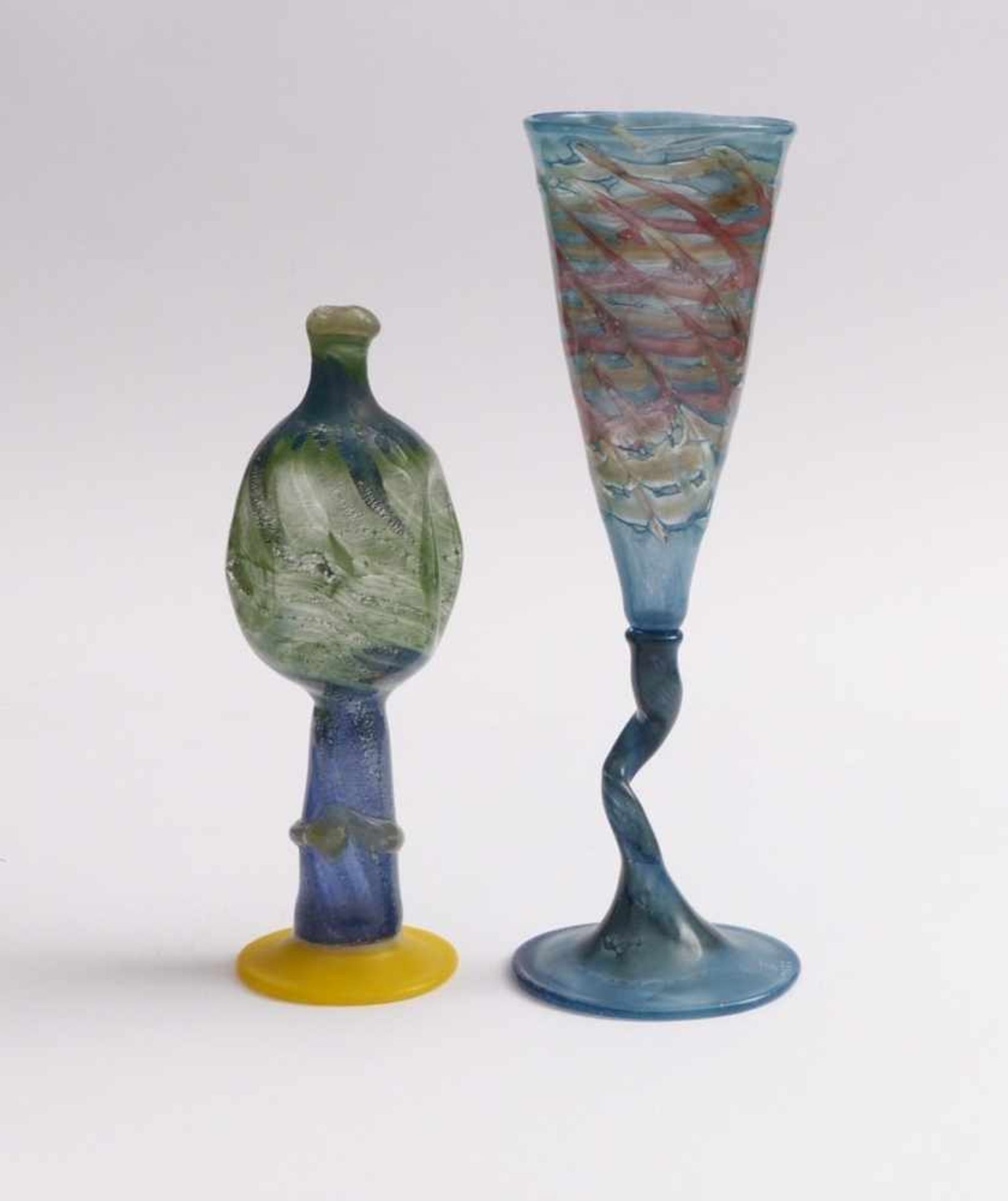 Goblet and oil lamp shaped vase20th C.Colorless and polychrome glass with powder and other