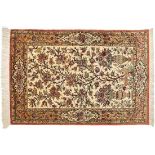 GhomIran, 20th c.In delicate shades of beige, green and red on an ivory ground, border with