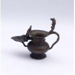 Oil lampIndiaFive-headed standing cobra on the leaf handle, curved wick bowl with Ganesha in