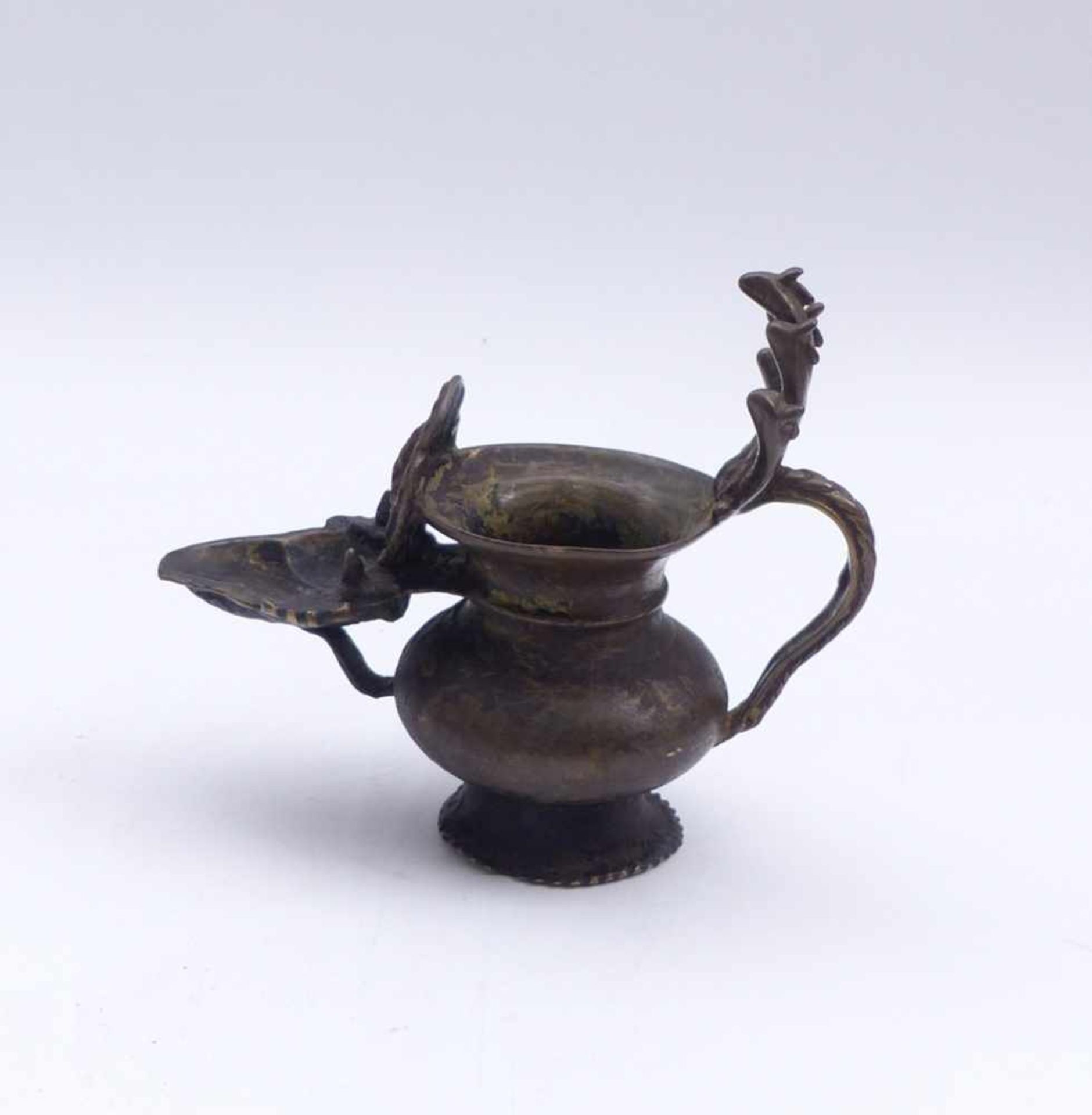 Oil lampIndiaFive-headed standing cobra on the leaf handle, curved wick bowl with Ganesha in