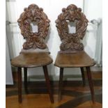 Two board chairs17th c. and laterThe backrests open carved with foliage. Various deciduous and