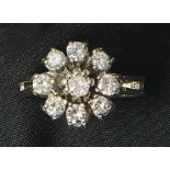 Diamond ring1970s9 round brilliant-cut diamonds totally approx. 1 carat, white gold 14k. Marked.