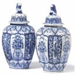 Pair of fireplace vases with coverDelft, around 1900On an eight-sided stand the ovoid, fluted