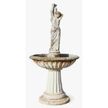 FountainBaroque styleColumn base, fluted shaft and basin with figure of a water bearer. Stone