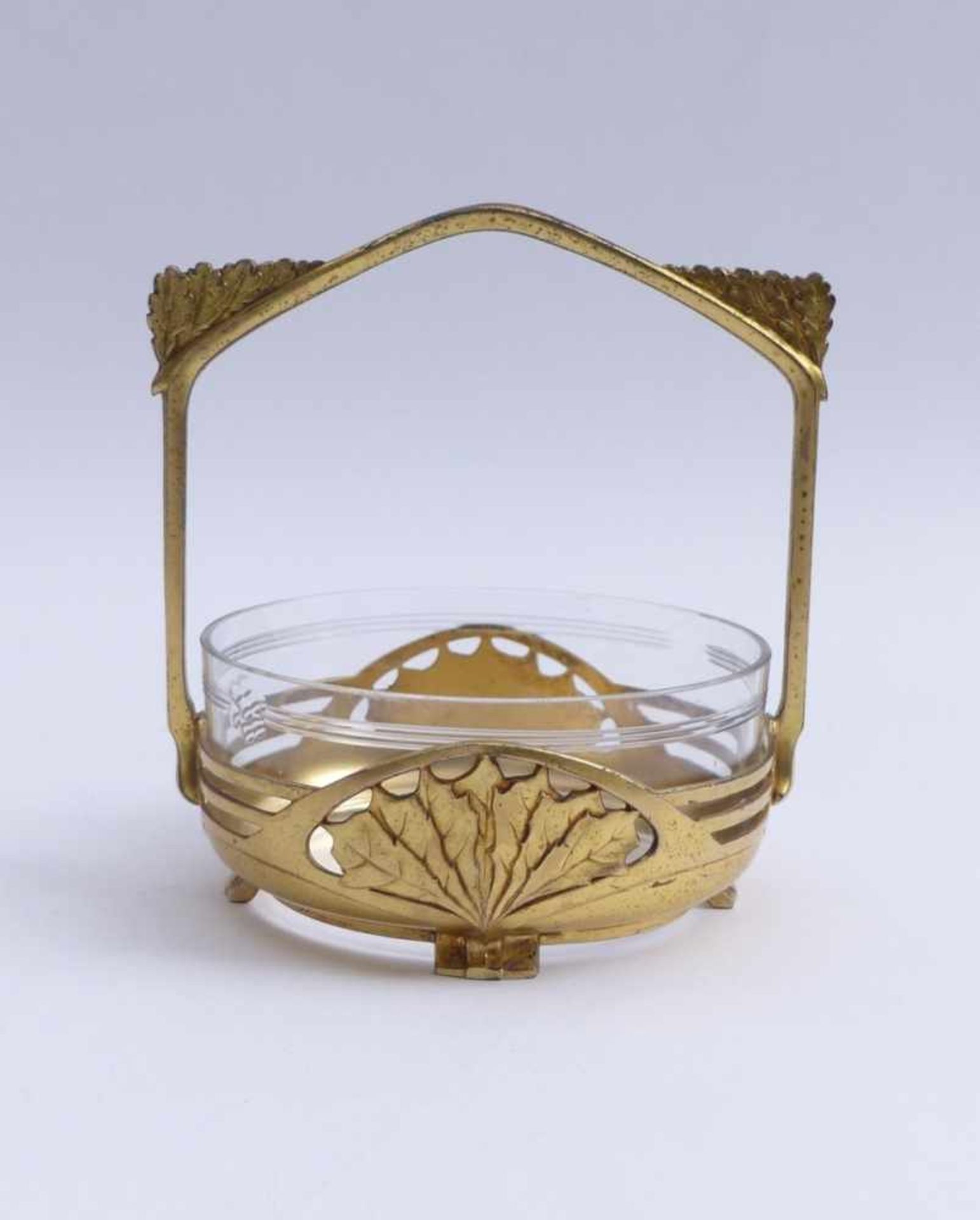 Confectionery bowl in mountGermany, around 1910/20Flat glass bowl with cut decoration in basket-