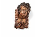 Small angel head appliquéFirst half of the 17th centuryWings arranged in a volute shape with