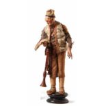 Neapolitan crib figure - Bagpipe playerLate 18th centuryAn elderly man standing on a pedestal in a