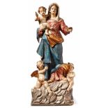 Madonna with the childFrance, 18th centuryAbove a plinth on a cloud base flanked by two winged