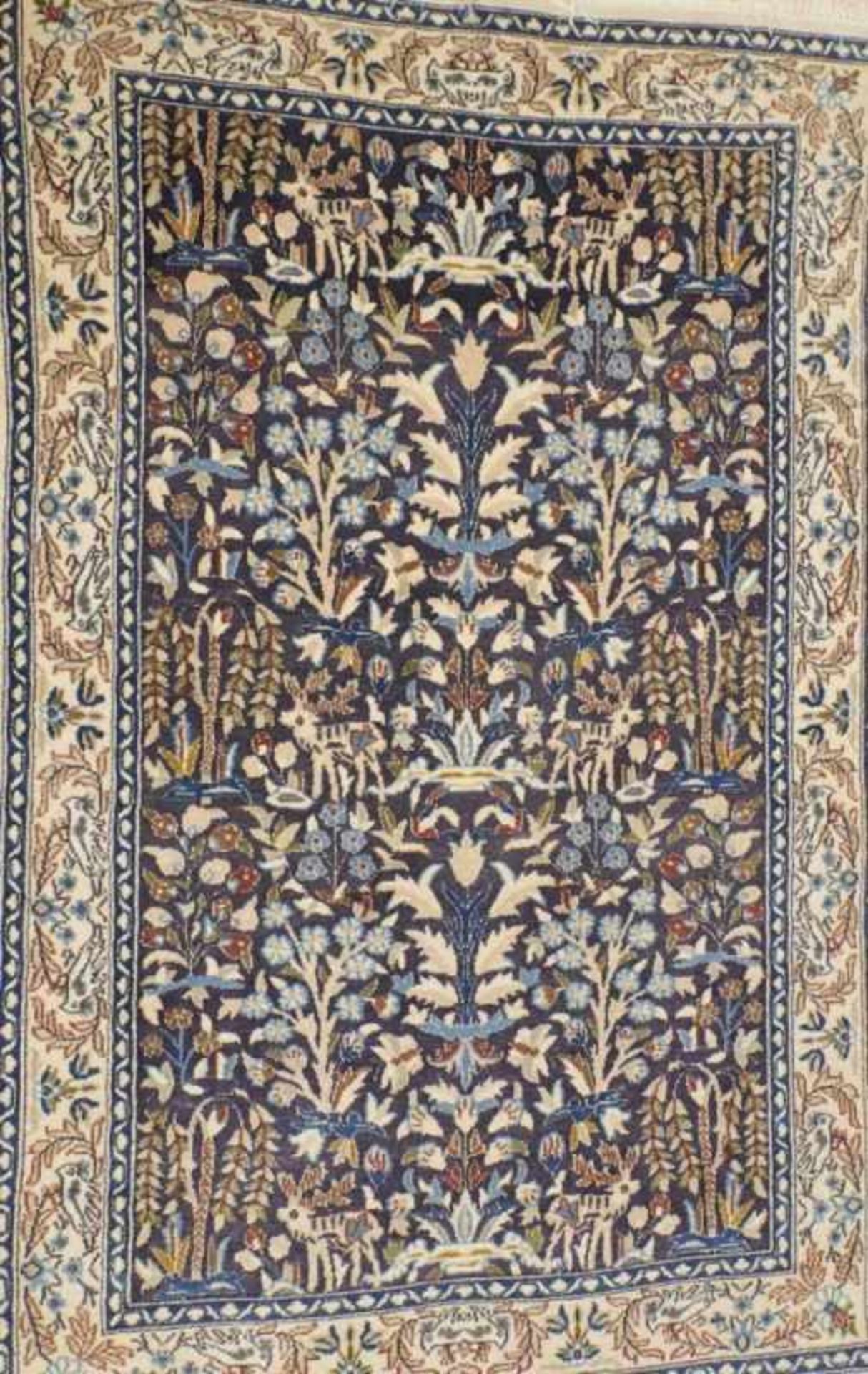 NainIran, 20th century.Beige ground border with tendrils and birds, blue ground centre field with