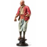 Neapolitan crib figurine - Oriental manLate 18th centuryOlder man standing on a profiled round