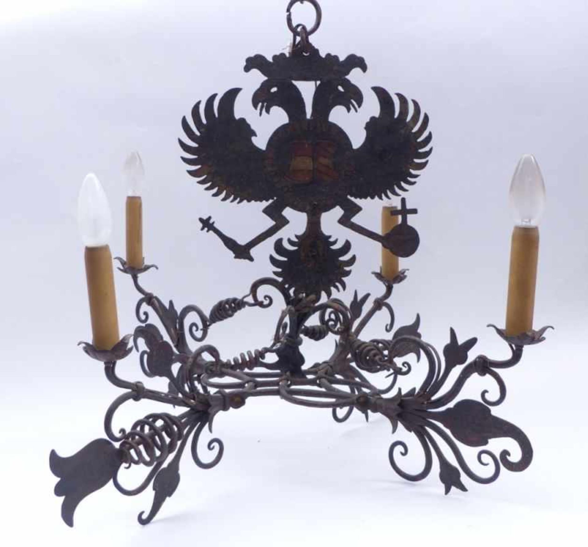 Iron chandelierAustria, 18th/19th c.Suspended with a painted double eagle, four cross-shaped