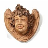 Angel's head17th centuryWinged angel's head, semicircular with long curly hair. Hardwood, carved,
