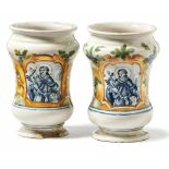 Two little albarelliItaly, 19th cent.White glazed maiolica, in parts painted with blue and other
