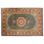 GhomIran, 20th c.In soft shades of red, blue and cream, border with arabesque palmettes and