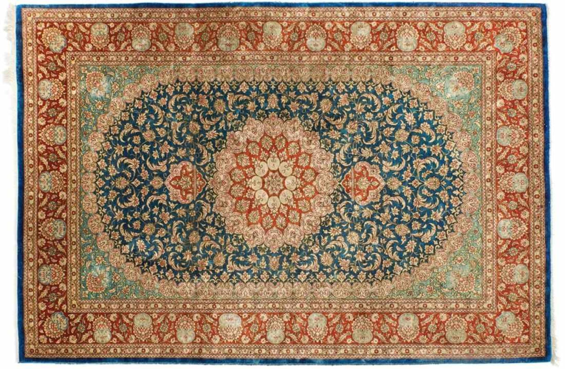 GhomIran, 20th c.In soft shades of red, blue and cream, border with arabesque palmettes and