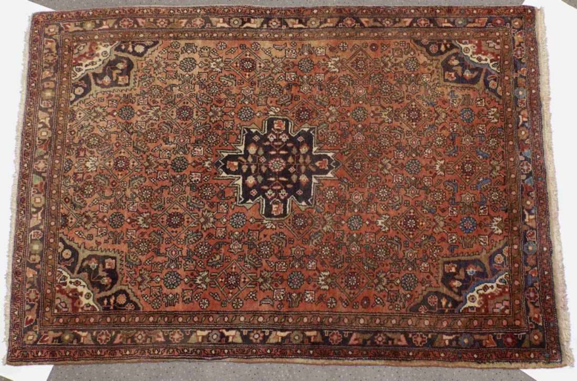 Bijar SandjanIran, 20th c.Red ground with ornaments and flower motifs in blue and beige. Wool. 150 x - Bild 2 aus 3