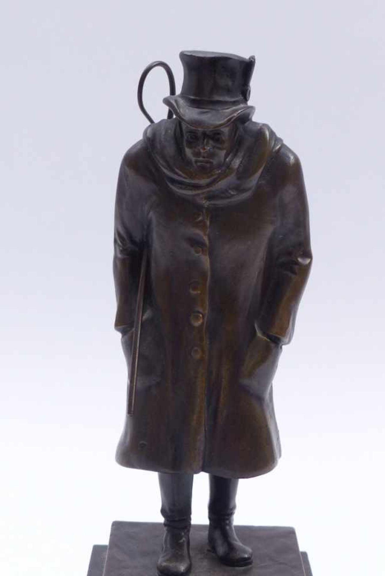 CoachmanEarly 20th centuryMan with hat standing on a rectangular plinth above a marble base, his - Bild 2 aus 3