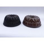 Two baking moulds19th centuryRound, multi-zone form, inner tube with open-worked star, flanged
