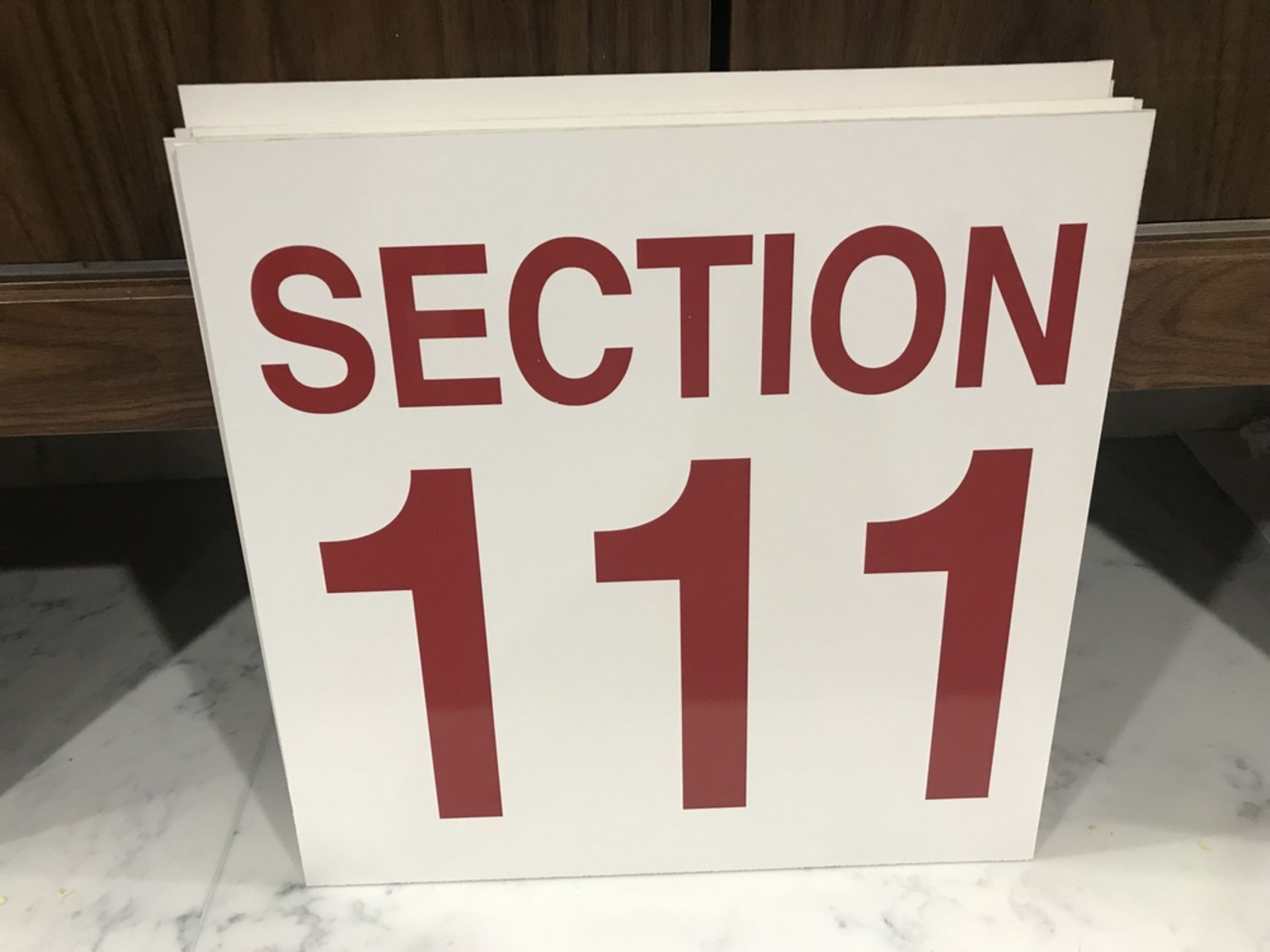 "Section 111" Sign , Dim. 16 in x 16 in , Location: Arena Seating ***Note from Auctioneer***This lot