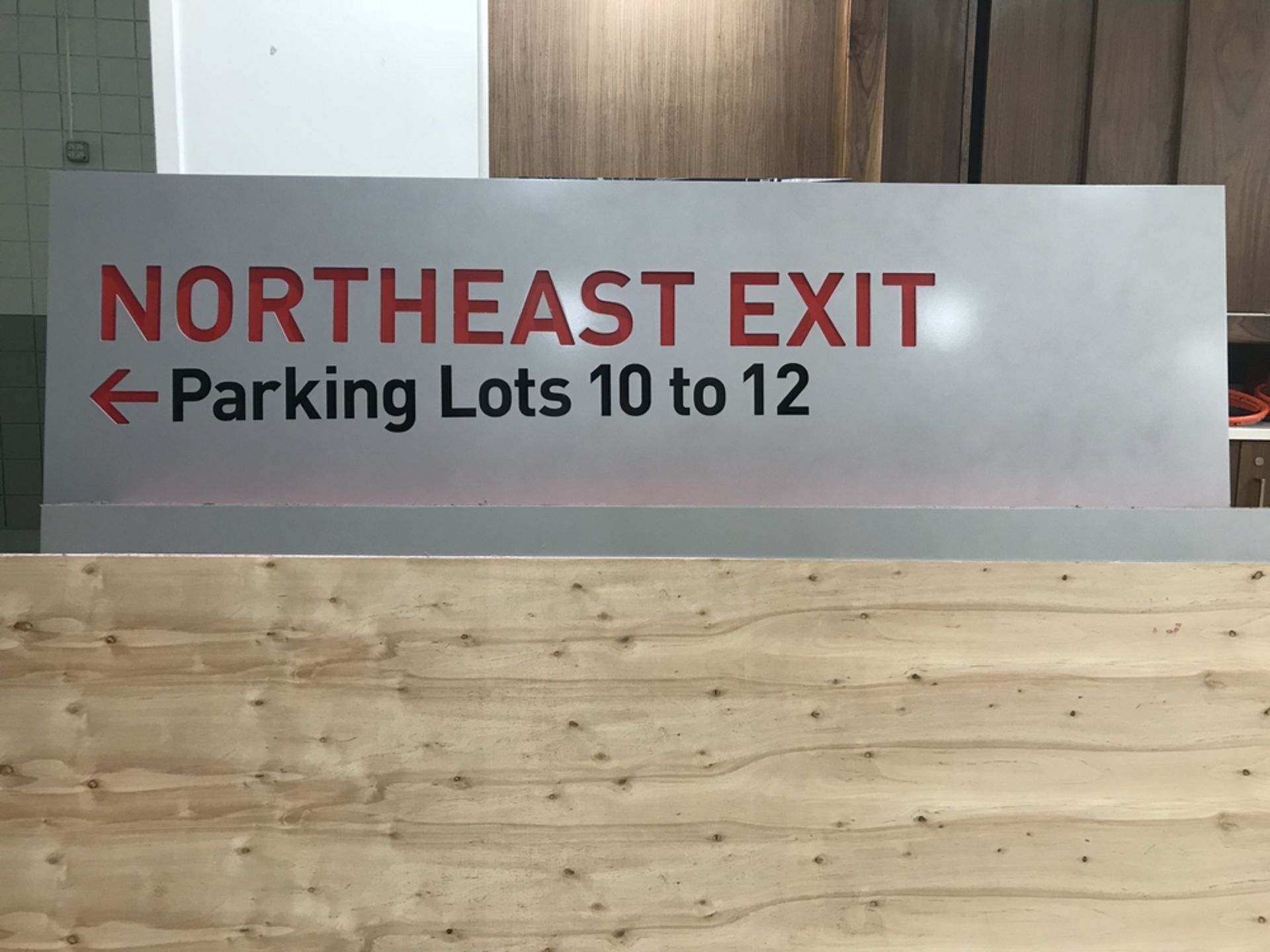 Lighted Sign "Northeast Exit Parking Lots 10 to 12" , Dim. 72 in x 20 in , Location: Concourse ***