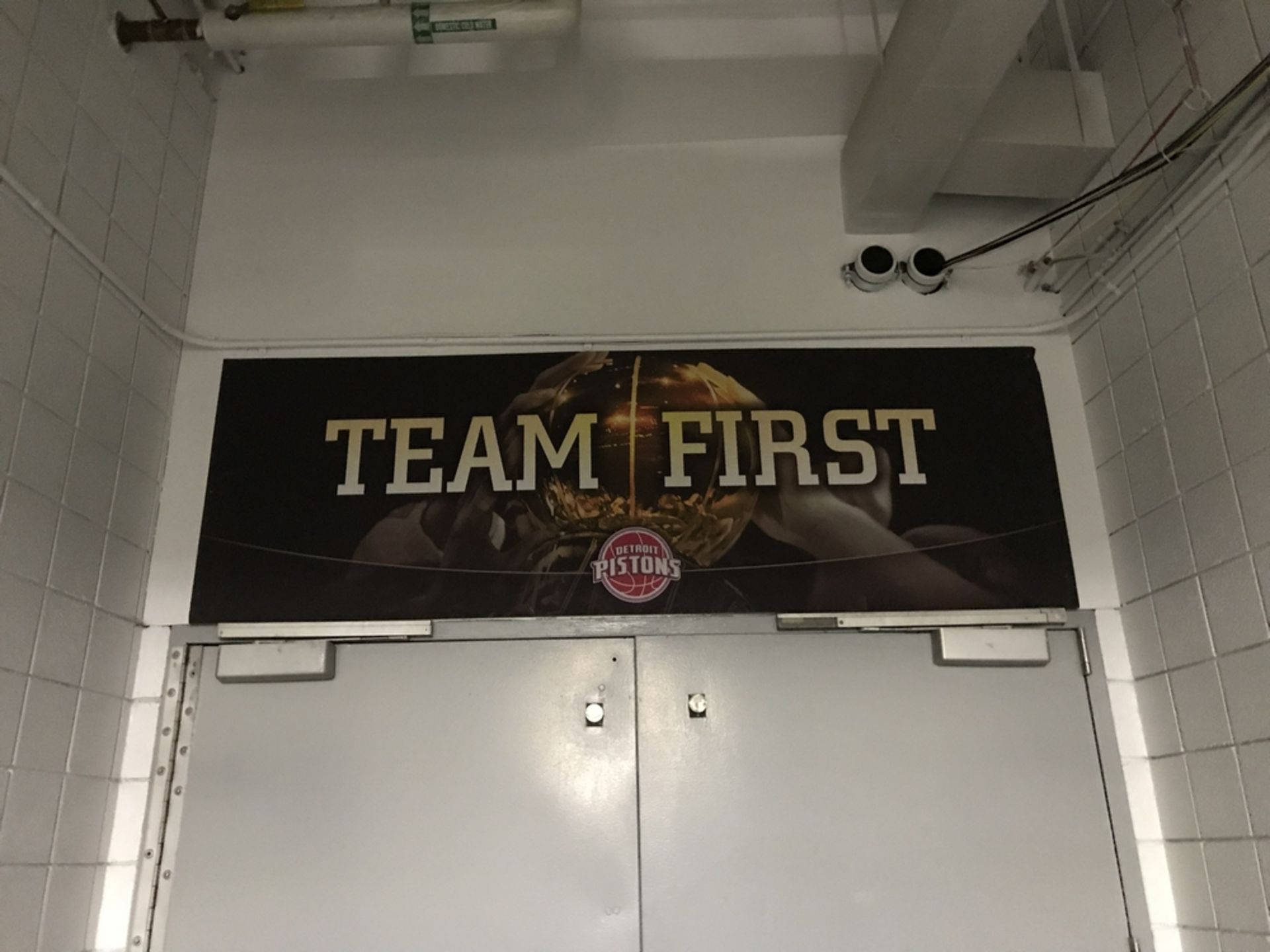 Sign Team First "Detroit Pistons" , Dim. 96 in x 32 in , Location: Tunnel From L.R. to Floor ***Note