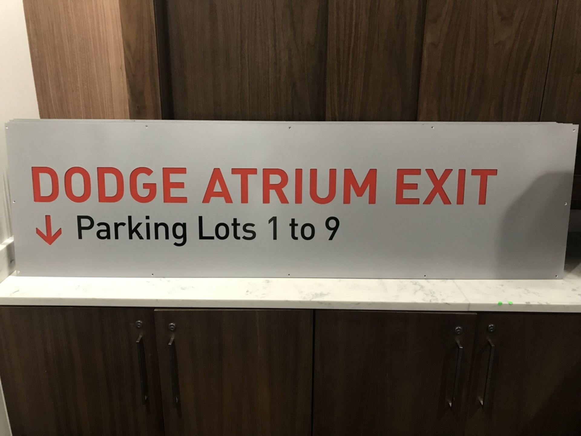 "Dodge Atrium Exit Parking Lots 1 to 9" Sign , Dim. 72 in x 60 in , Location: Concourse ***Note from