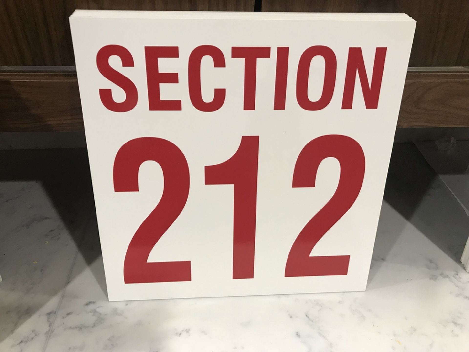 "Section 212" Sign , Dim. 16 in x 16 in , Location: Arena Seating ***Note from Auctioneer***This lot