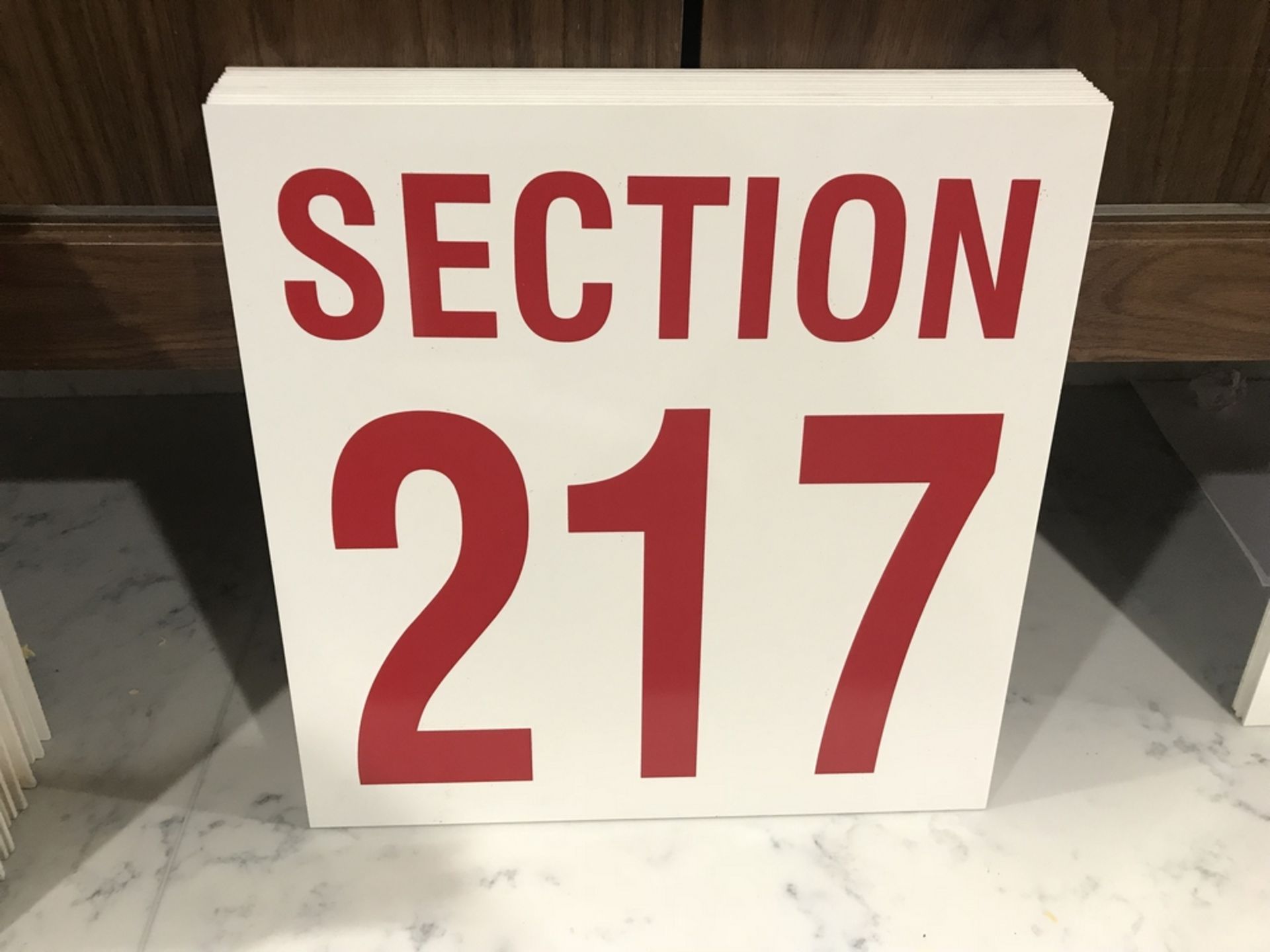 "Section 217" Sign , Dim. 16 in x 16 in , Location: Arena Seating ***Note from Auctioneer***This lot