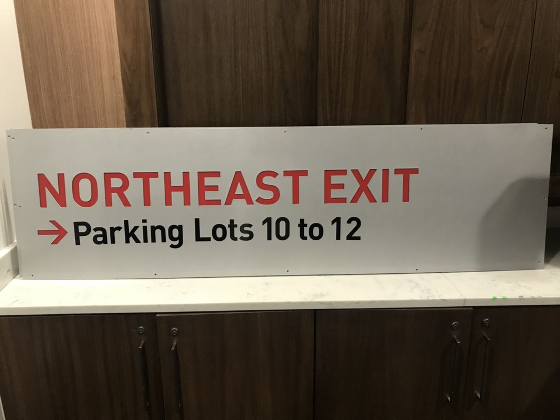 "Northeast Exit Parking Lots 10 to 12" Sign , Dim. 72 in x 20 in , Location: Concourse ***Note