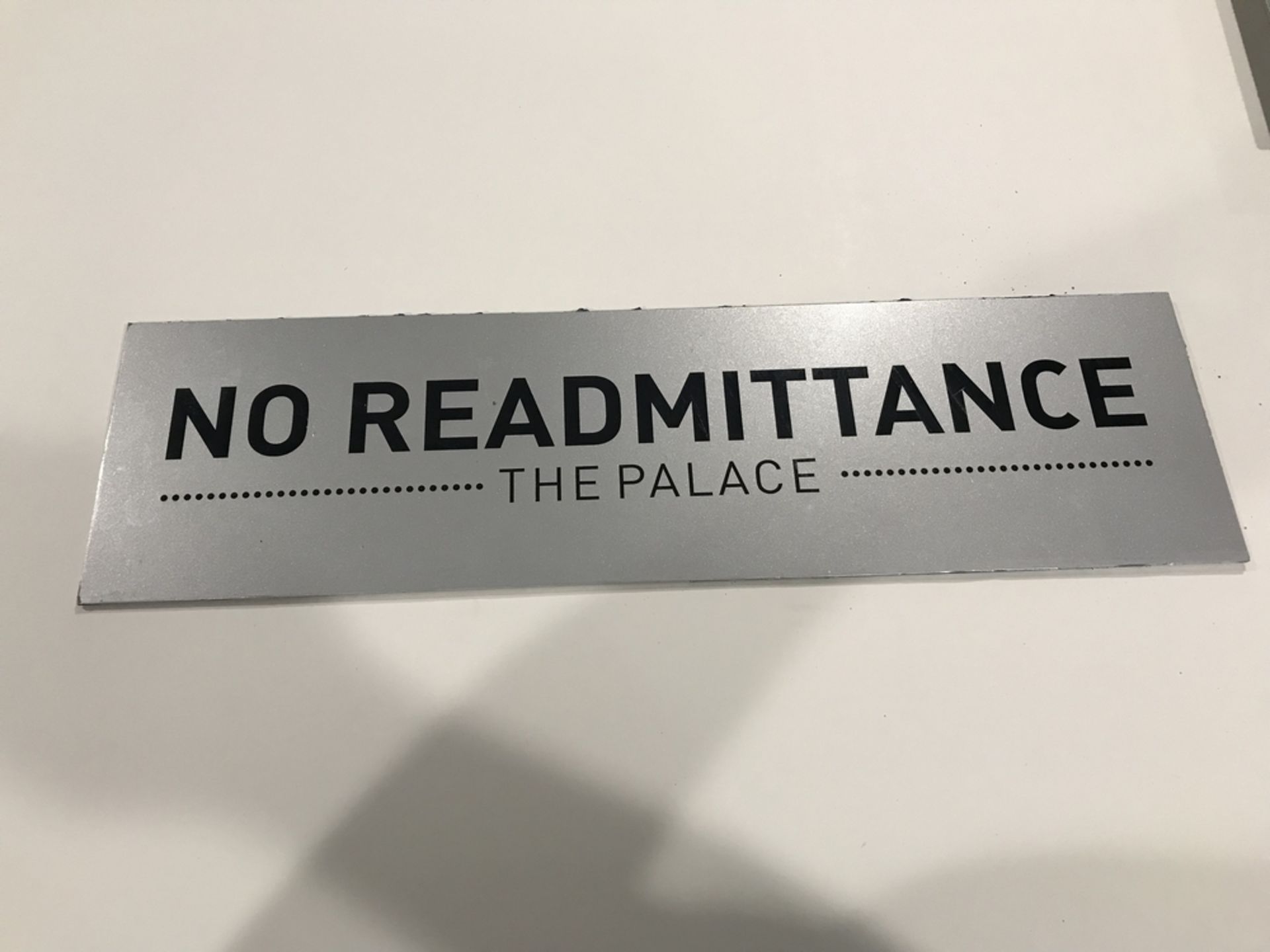 "No Readmittance" Sign , Dim. 24 in x 7 in , Location: Entrance ***Note from Auctioneer***This lot
