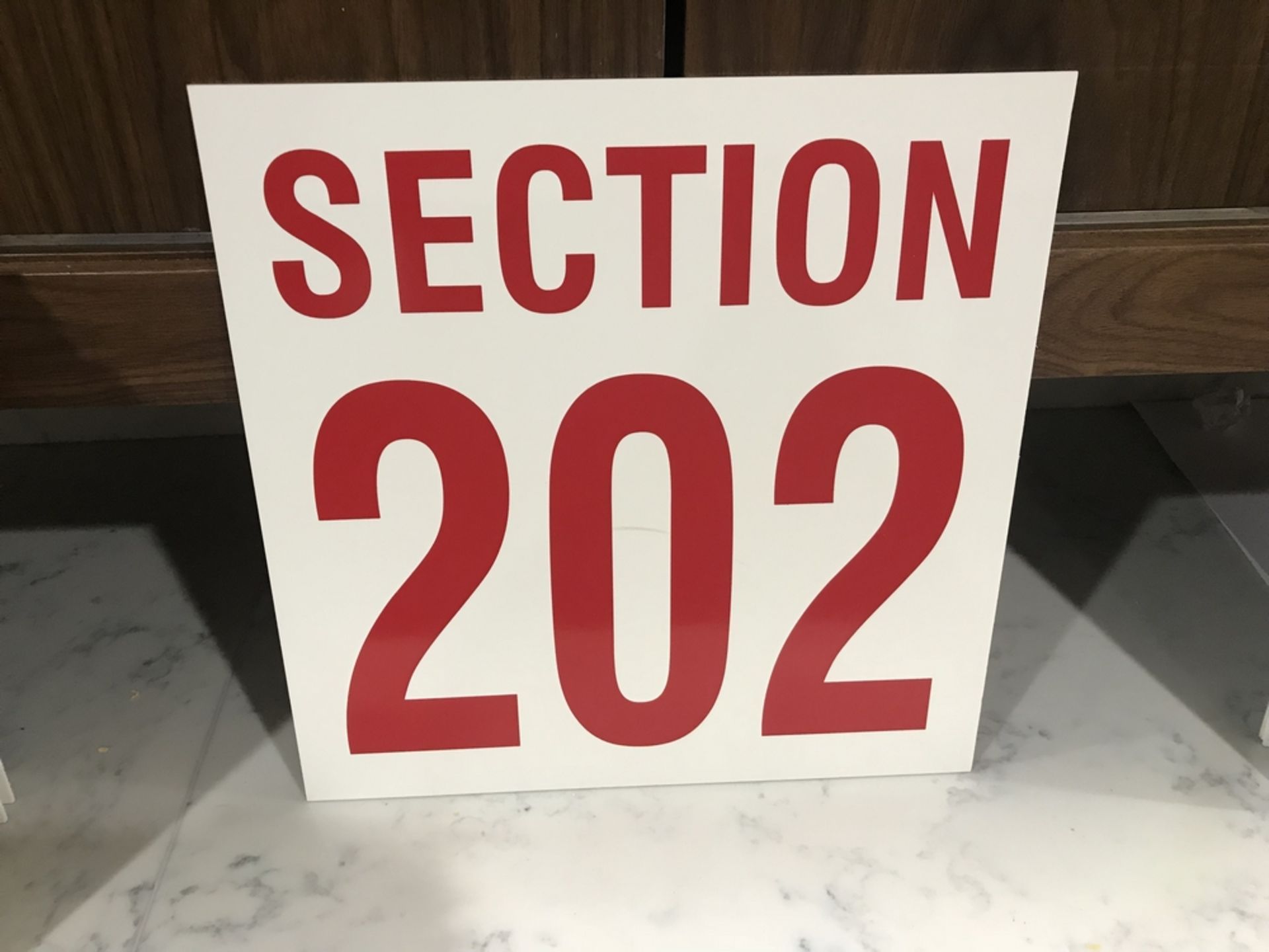 "Section 202" Sign , Dim. 16 in x 16 in , Location: Arena Seating ***Note from Auctioneer***This lot