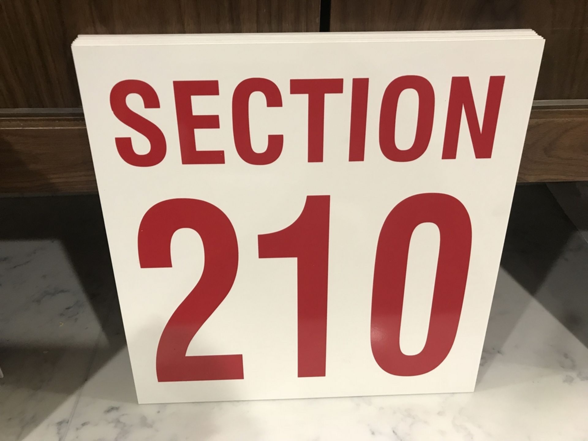 "Section 210" Sign , Dim. 16 in x 16 in , Location: Arena Seating ***Note from Auctioneer***This lot